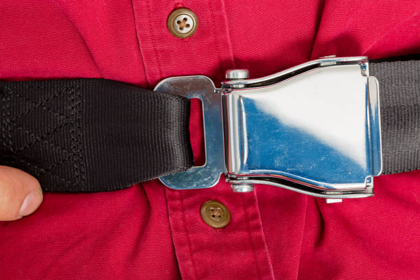istock Tightly clinched seat belt buckle on a passenger 923103626