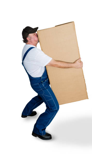istock Delivery man carrying heavy cardboard box 923104402