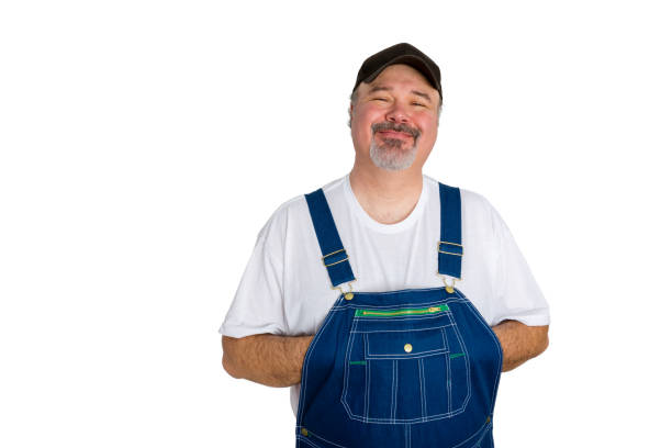 istock Smiling man wearing dungarees on white background 923104744