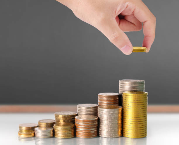 istock human hand putting coin to money 923111298