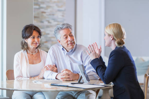 istock Senior couple talking with financial advisor 923126702