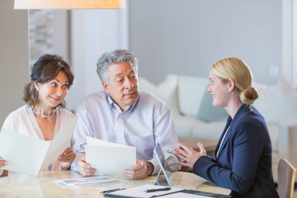 istock Senior couple talking with financial advisor 923126850