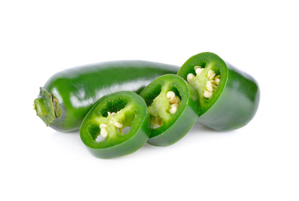 istock whole and portion cut fresh Jalapeno or Mexican Chili on white background 923132306