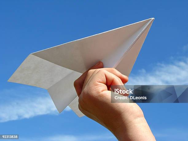 Child Hand With Paper Plane Stock Photo - Download Image Now - Paper Airplane, Blue, Child