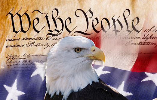 Constitution of America, We the People with bald eagle and American flag.