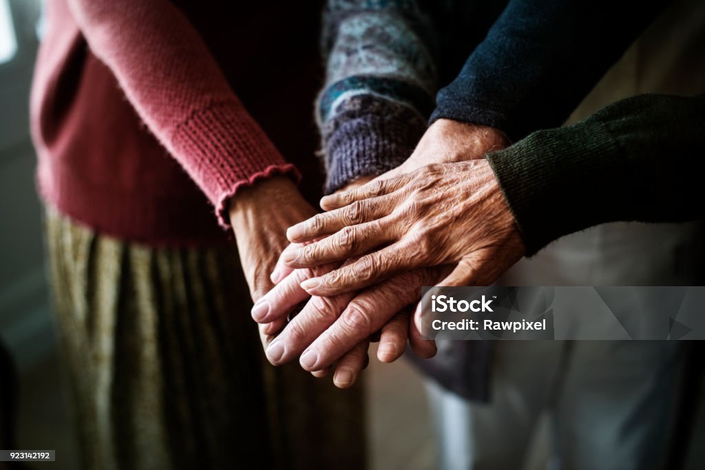 Closeup of hands of group of seniors Senior Adult Stock Photo