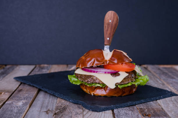istock Delicious gourmet cheeseburger with knife 923142666