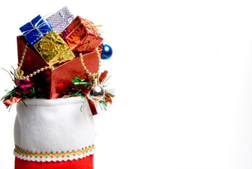 A Christmas stocking filled with holiday goodies.