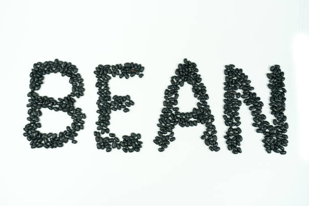 An arrangement of black beans into letters.