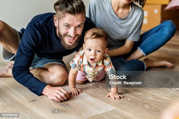 Family Move In New House Stock Photo - Download Image Now - Family, Hardwood Floor, Moving House