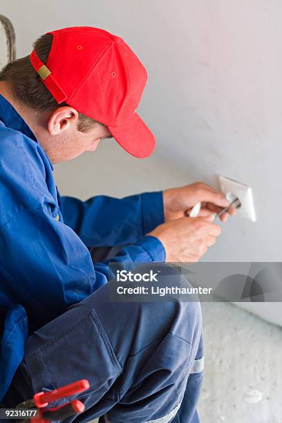 Installing A Plug Stock Photo - Download Image Now - Electrician, Working, Adult