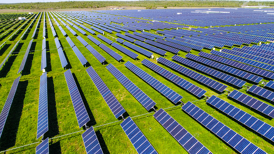 hundred of Blue Photovoltaic Solar Cells Massive Solar Panel Power Plant right outside of Austin , Texas ,USA a Smart Futuristic City providing clean energy and renewable energy for a sustainable future