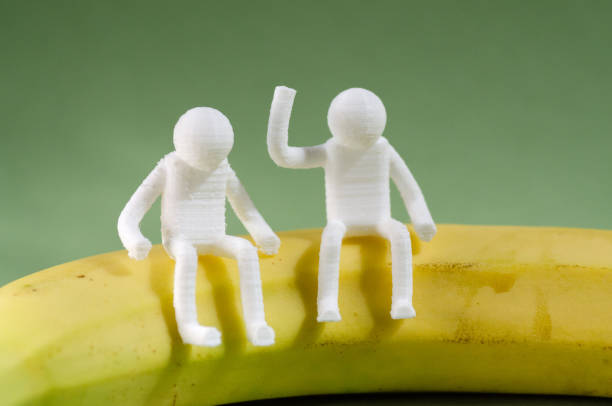People Sitting On A Banana