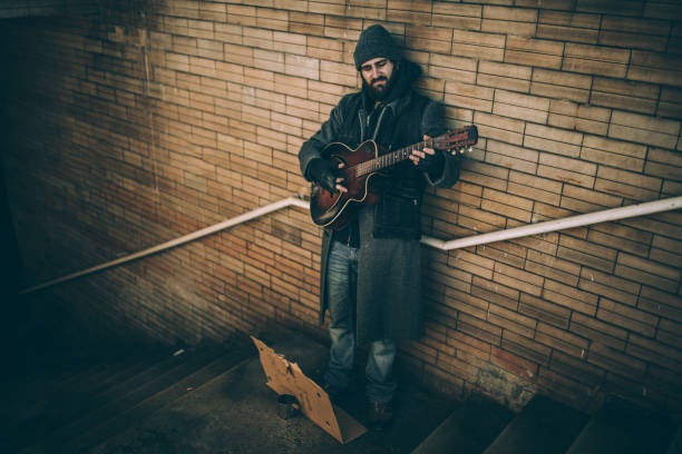 istock Guy playing guitar on the street 923180234