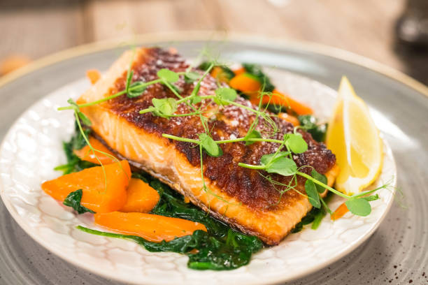 istock Salmon steak with carrot and spinach 923184580