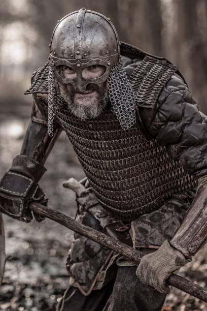 istock Weapon wielding bloody viking warrior alone in a winter forest 923186310