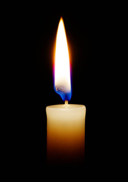 istock Burning candle on a black background closeup 923186366