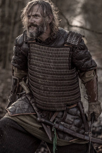 istock Weapon wielding bloody viking warrior alone in a winter forest 923186614