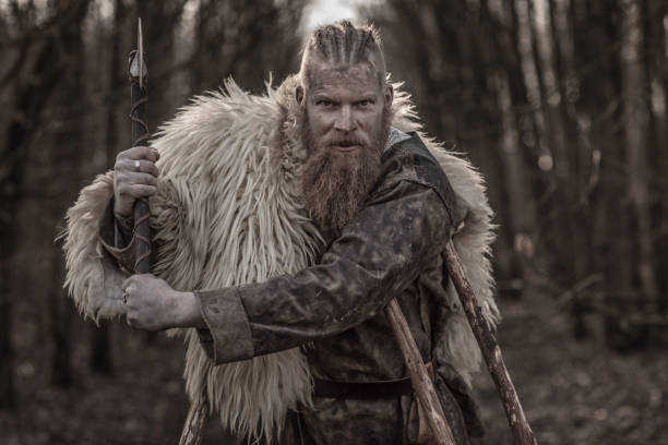 istock Weapon wielding bloody viking warrior alone in a winter forest 923186662