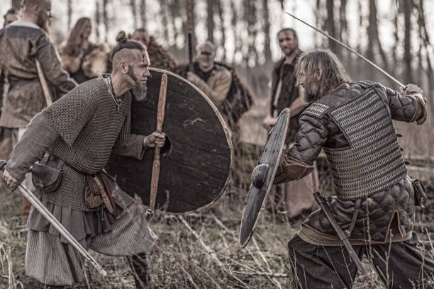 istock Bloody viking warriors on a winter battlefield forest 923189064