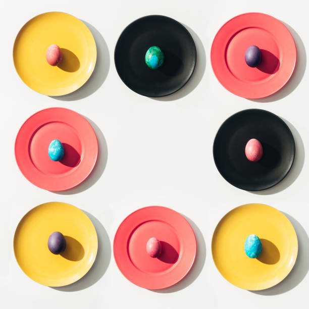 istock frame of easter eggs on colorful plates with copy space 923190426