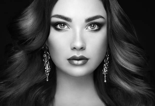 istock Brunette woman with long shiny wavy hair 923190816