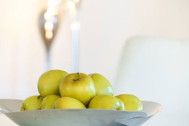 Decoration in a kitchen with fresh green apples