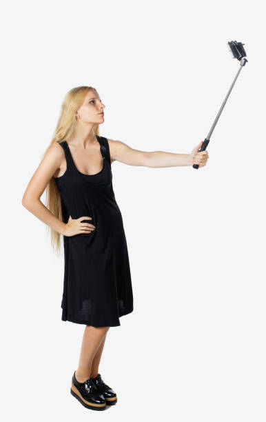 istock back view of standing young beautiful  girl with tablet computer 923200866