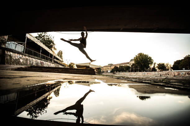 istock Young male ballet dancer dancing in the streets 923201634