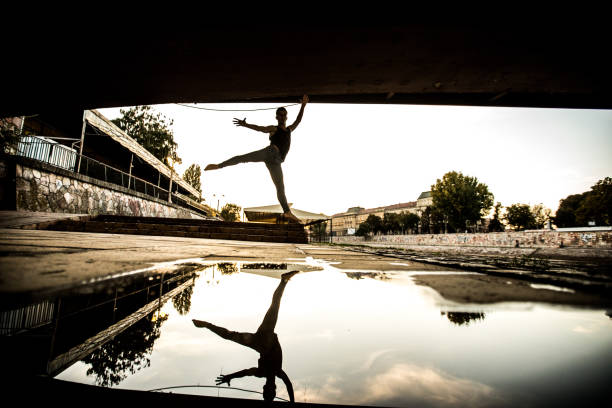 istock Young male ballet dancer dancing in the streets 923201792