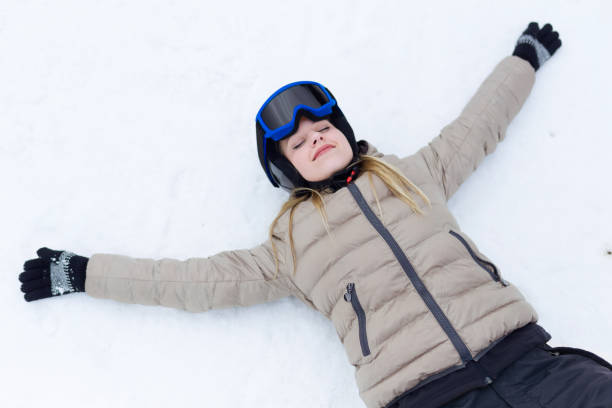 istock Beautiful young woman having fun over winter background. 923204890