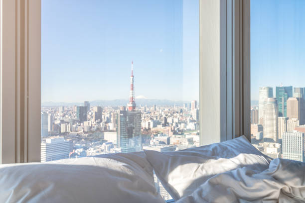 Morning sunshine on the bed with cityscape stock photo