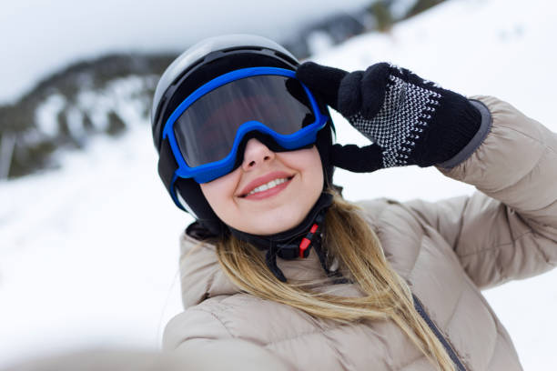 istock Beautiful young woman having fun over winter background. 923207052