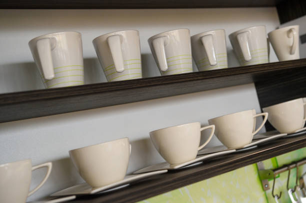 istock Coffee cups on wooden shelf 923212910