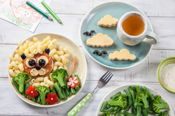 istock Funny Lion Food Face with Cutlet, Pasta and Vegetables 923213066