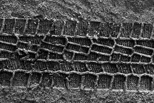 Tyre tracks on sand. Abstract background and pattern.