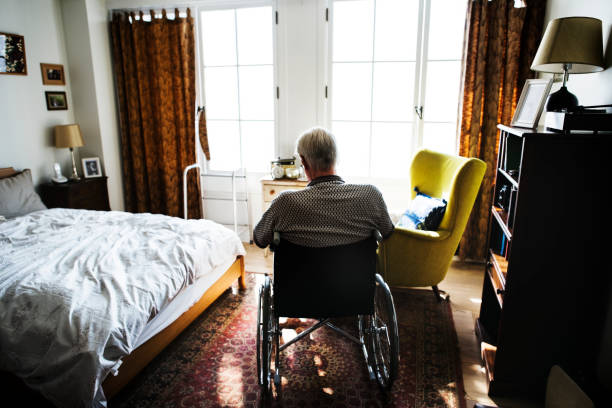 istock Senior man sitting on the wheelchair alone 923216834