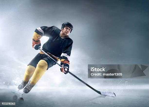 Ice Hockey Player In Action Stock Photo - Download Image Now - Hockey, Ice Hockey, Playing