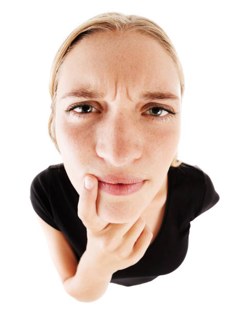 istock Distorted look at cute girl looking puzzled 923218626
