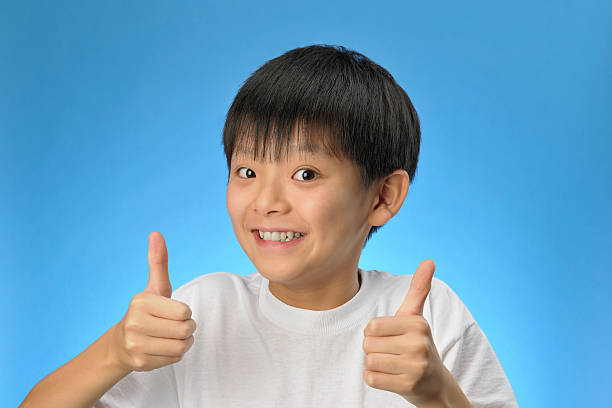 istock Boy's showing thumbs up sign 92322135