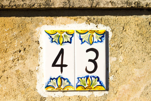 istock Italy: Number 43 Ceramic Street Address Tile On Old Wall 923221796