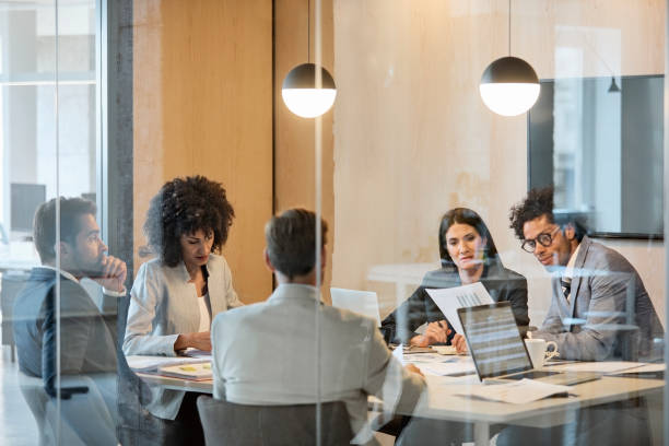 istock Multi-ethnic coworkers planning in board room 923221924