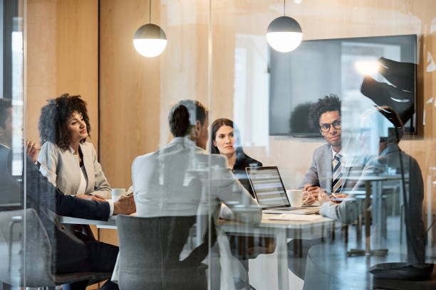 istock Multi-ethnic coworkers discussing at office 923222016
