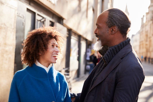 istock Middle Aged Couple Walking Through City In Fall Together 923222510