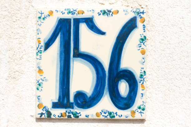 istock Italy: Ceramic Number 156 Street Address Tile; White Wall 923224748