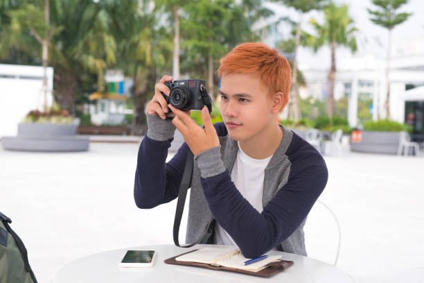 istock Young Asian traveling backpacker having fun in the city 923224850