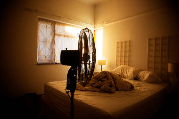 istock Electric fan in-front of an unmade bed 923224878