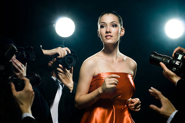 istock A woman surrounded by paparazzi 92322512