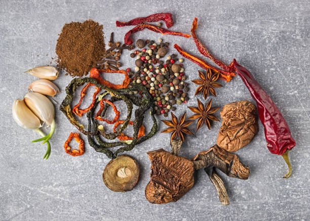 istock Spices on the stone gray background. Condiments on a dark table. Seasoning for cooking. 923225680