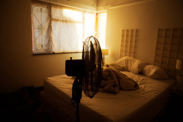 istock Electric fan in-front of an unmade bed 923225864